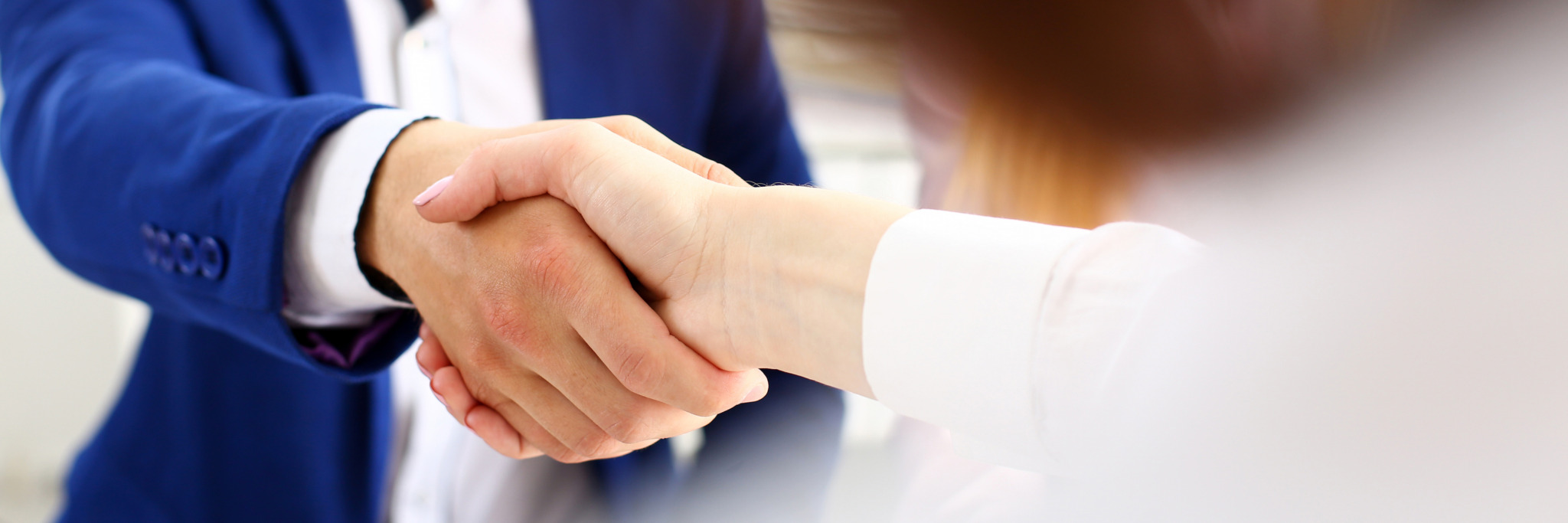 iStock-1070900014 Man in suit shake hand as hello in office closeup. Friend welcome, mediation offer, positive introduction, greet or thanks gesture, summit participate approval, motivation, strike arm bargain concept